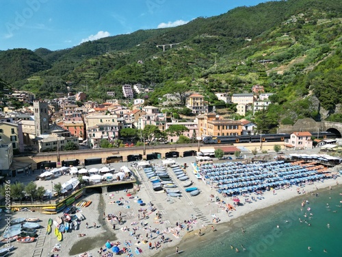 Train passing next to the beach in Monterosso, Cinque Terre, Liguria , Italy .