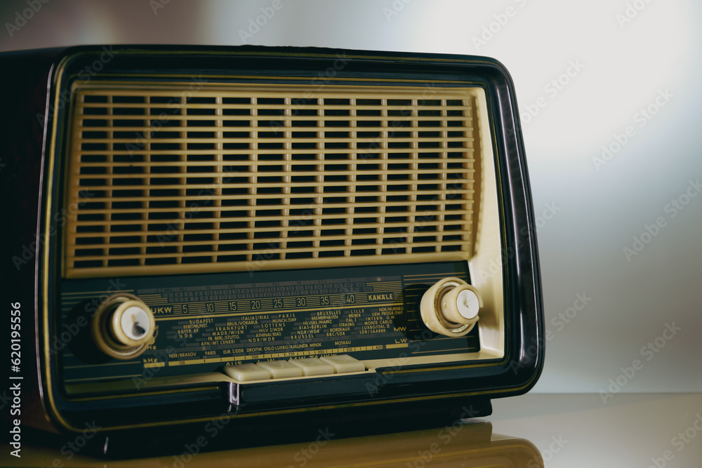 Classic analogue table radio, visible the scale with the names of the ...