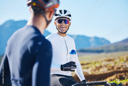Fototapeta Naklejka Na Ścianę i Meble -  Fitness, bike and water with friends in nature for cycling, taking a break from their cardio or endurance workout. Exercise, mountain and a man cyclist team outdoor to relax during sports training