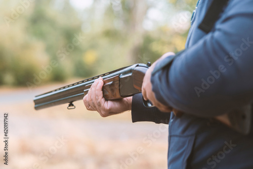 Male hunter ready to hunt with hunting rifle.hunter Holds a rifle.