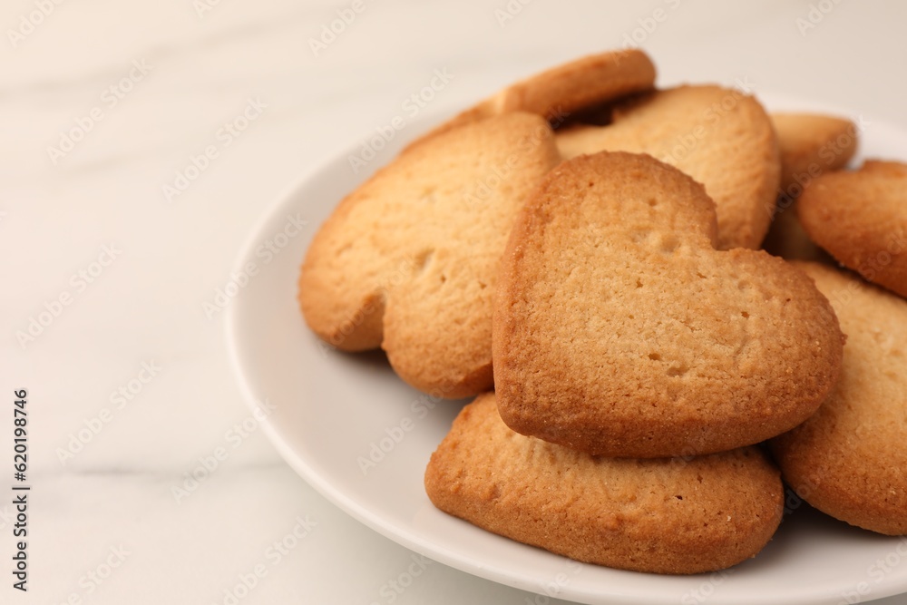 Heart shaped Danish butter cookies on white marble table, closeup Heart shaped Danish butter cookies on white marble table, closeup