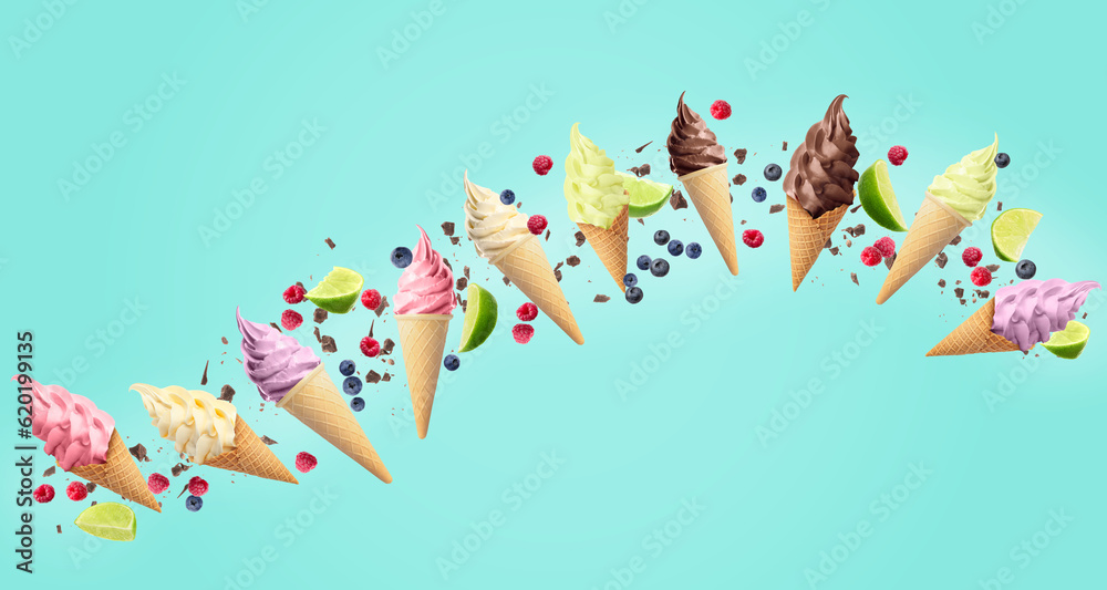 Obraz premium Delicious different ice cream, raspberries, blueberries, pieces of lime and chocolate falling on light blue background