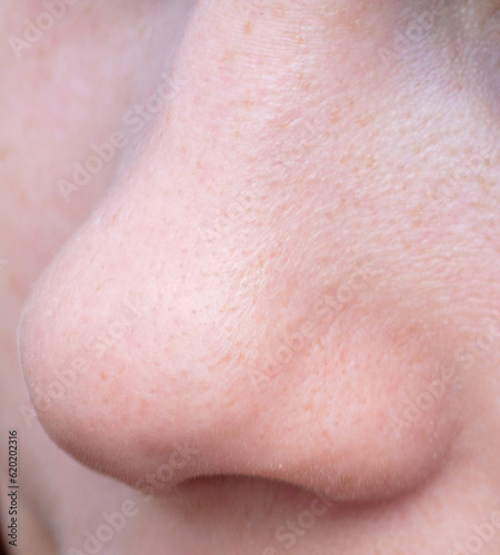 Close-up of a girl s nose. Macro