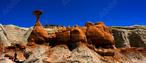 People in Silhouette at Toadstool Hoodoos in Southwest Red Sandstone Blue Sky Wilderness photo