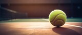 Close-up on tennis ball on sunny day. View of tennis grass court. Sport lifestyle background. Summer template or banner. The concept of outdoor game sports.Generative ai