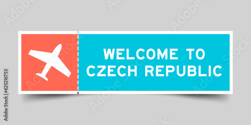 Orange and blue color ticket with plane icon and word welcome to czech republic on gray background