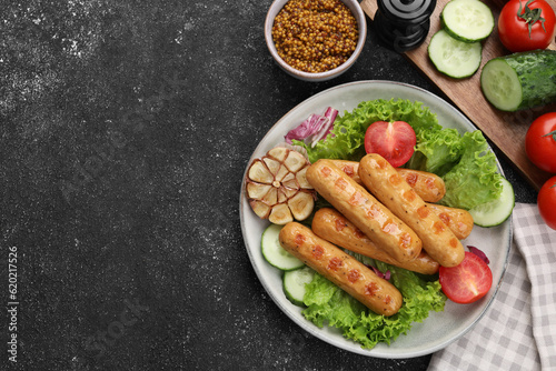 Delicious grilled vegan sausages with fresh herbs and vegetables on grey table, flat lay. Space for text