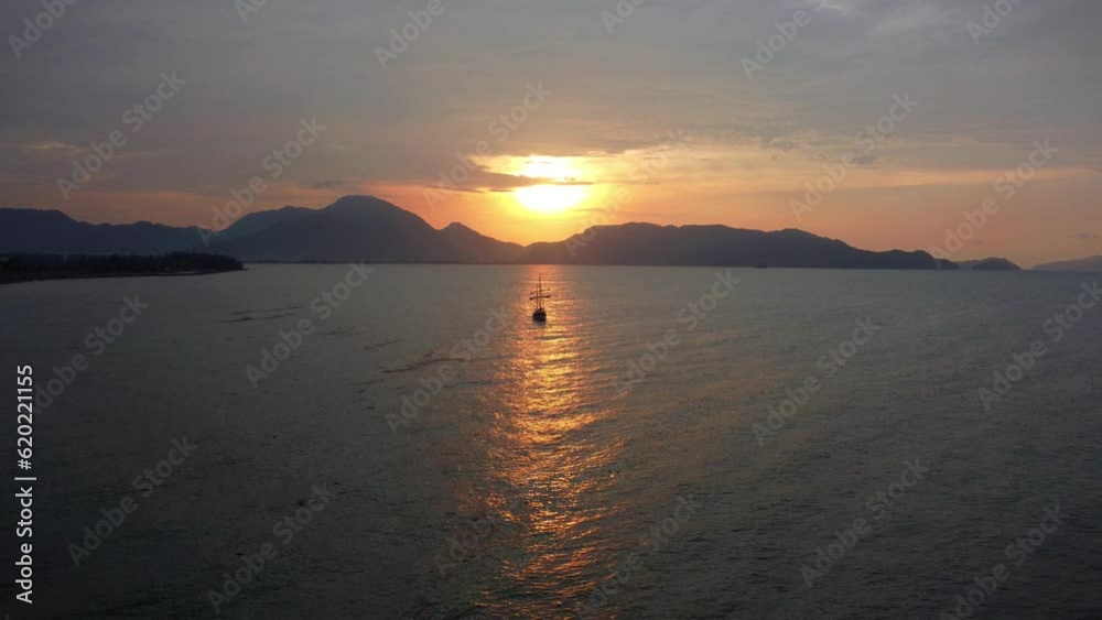 Cinematic aerial view of sunset waves off the coast of Aceh, Indonesia. Cinematic aerial view of sunset waves off the coast of Aceh, Indonesia.