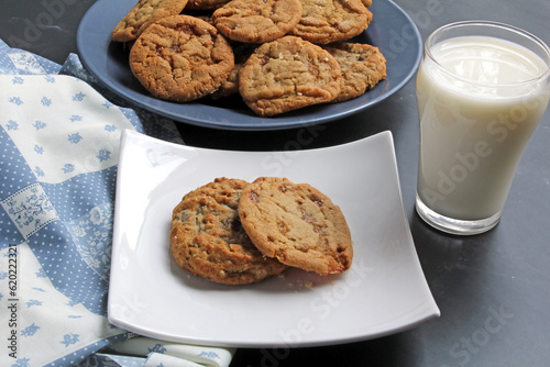 A snack of toffee cookies and milk photo