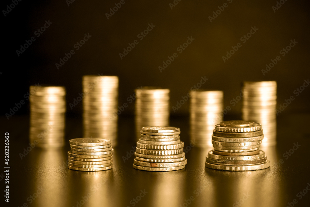 stack of golden money coin on black background. Business and financial concept. stack of golden money coin on black background. Business and financial concept.