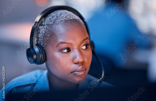 Safety, security or woman in call center for emergency or legal service thinking of danger in office at night. Worker, law patrol or face of female police contact agent with headset for communication