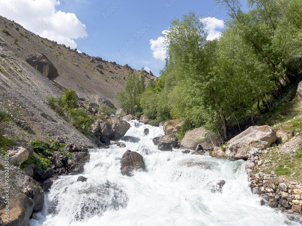 Water rushes through the mountain valley Water rushes through the mountain valley