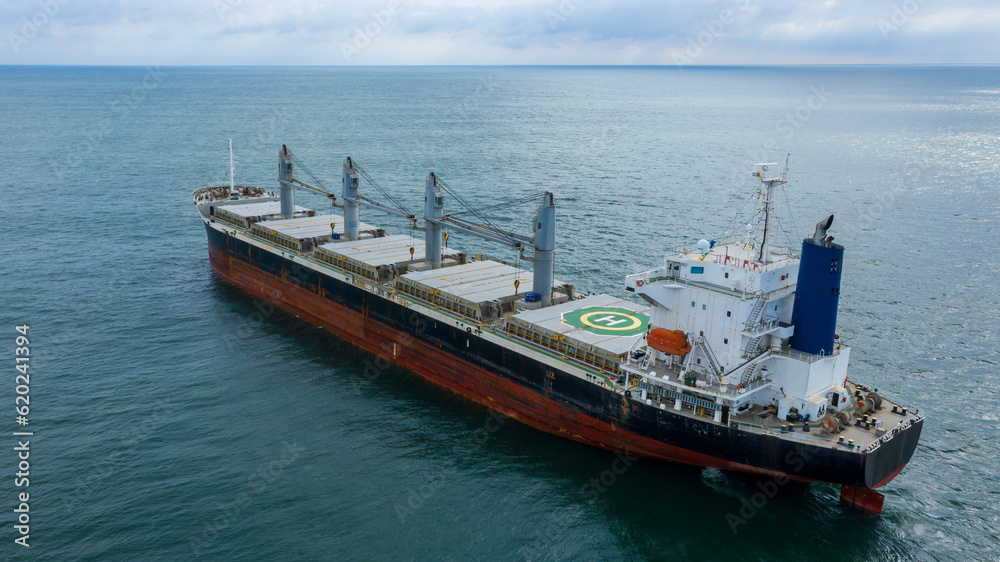 Self-unloading bulk carrier at Rio De La Plata anchorage. Aerial stern view.