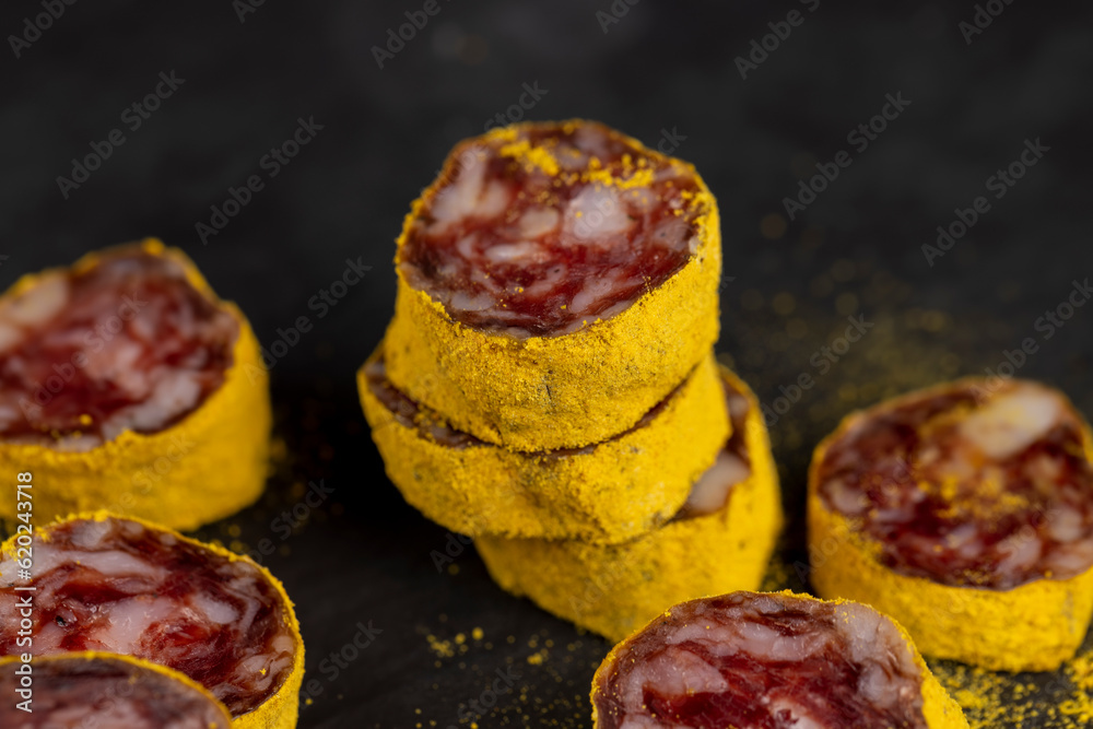 marinated in young turmeric pork sausage on black slate marinated in young turmeric pork sausage on black slate