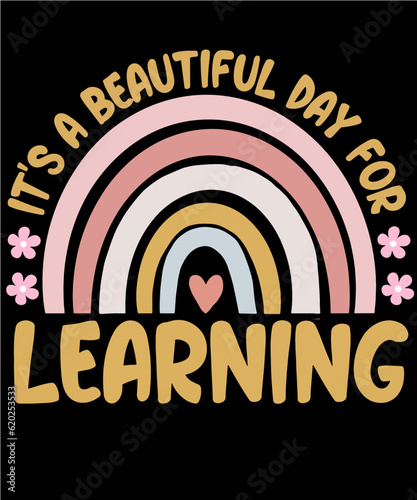 Pastel and gold colored rainbow with heart and flowers and the creative saying It's a beautiful day for learning