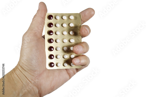 birth control pills in hand