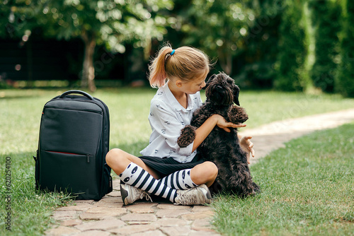 Back to school. Cute child girl with backpack going to school with fun