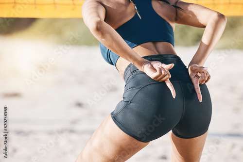 Beach, fitness and a woman with volleyball hand sign for communication or block signal. Behind female person or healthy athlete body ready for sports, workout or fun game outdoor on sand in summer