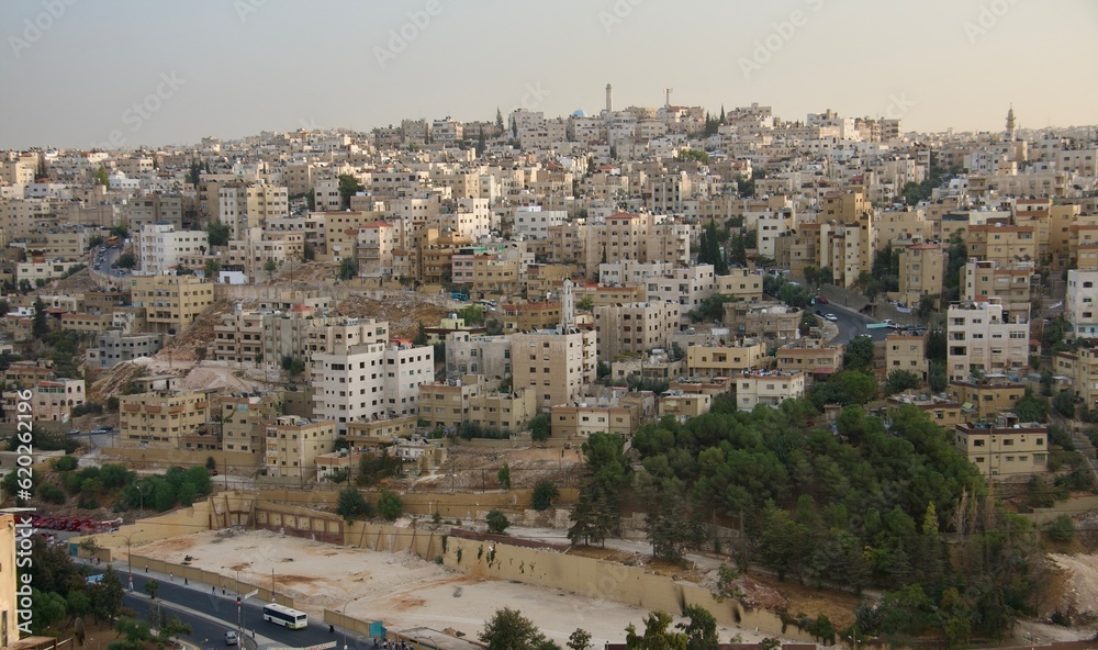 Cityscape view over Amman in Jordan, with mosque at top of the hill