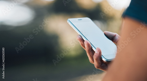 Closeup hands, phone and communication for social media, networking or chat on mockup screen in nature outdoors. Person, mobile or smartphone app for texting, online browsing or mock up space banner
