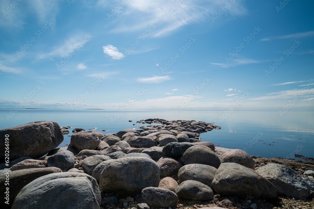 The rocky shore of the Baltic Sea. Beautiful sunny summer day, calm sea. Baltic Sea Estonia Kihnu Island