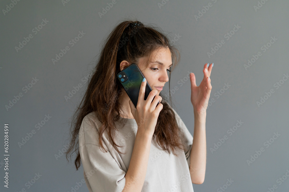 young girl emotionally talking on the phone young girl emotionally talking on the phone