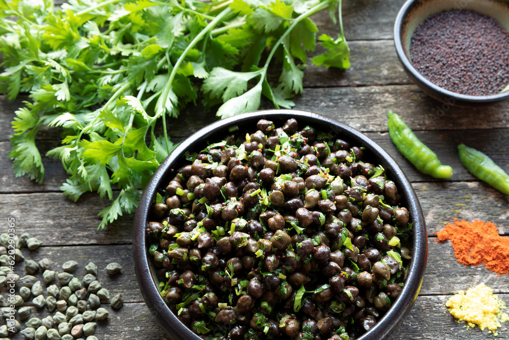 Green Chickpea Chaat meal with ingredients fresh coriander, black