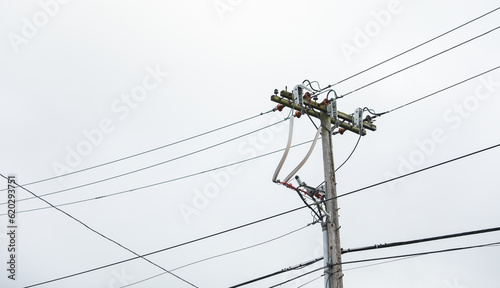 network of high voltage overhead power lines represents the dynamic energy and interconnectedness of the industrial electricity sector.