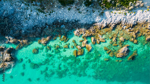 Fototapeta Naklejka Na Ścianę i Meble -  aerial view from the drone of a Caribbean and crystalline sea with the sheer cliff. This image conveys a sense of peace and tranquility immersed in unspoiled nature
