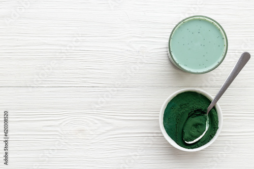 Spirulina algae powder and green latte, top view. Super food concept