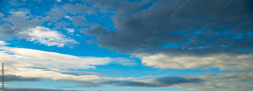 Blue sky with rain storm cloud over ocean shot at 44 mm focal length