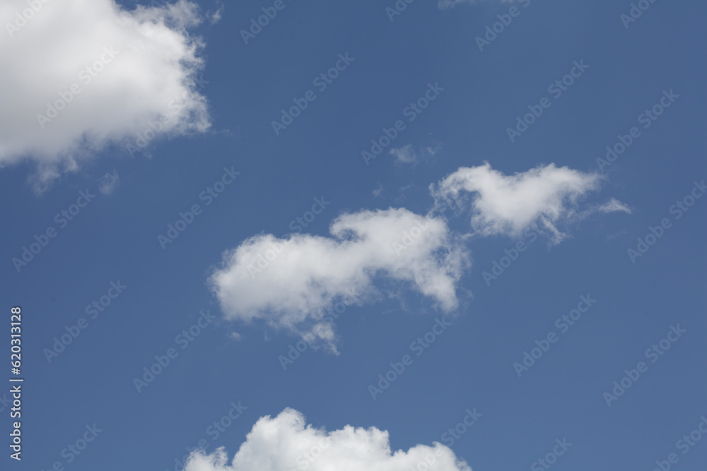 Blue summer sky white cumulus clouds background. Blue summer sky white cumulus clouds background.