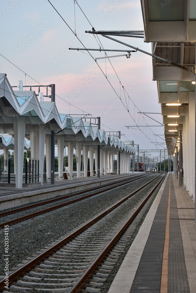 Fototapeta premium railway station in the city on a sunset 