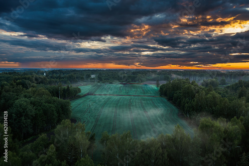 Aerial view of sunset over countryside fields