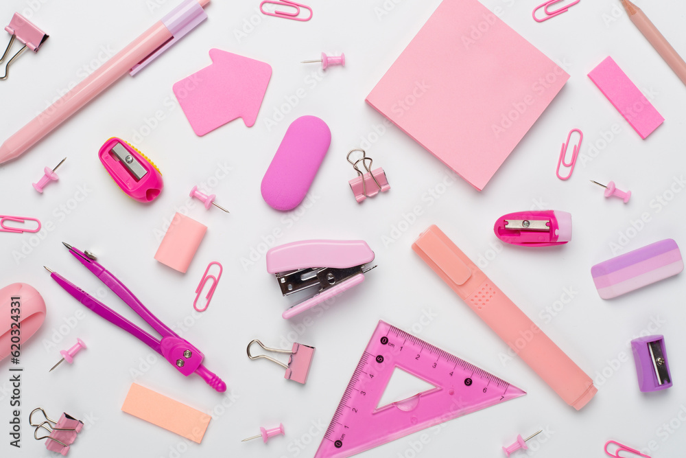 Pink school stationery on color backgroung, top view Pink school stationery on color backgroung, top view
