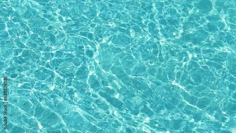 Water caustic texture. Blue water caustic surface in slow motion. Top view. POV. Video can use in vertical position. Video cover