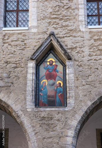 Fragment of the wall of the old city hall. Tallinn, Estonia. Painting - Judgment Day - in a niche above the fifth pylon of the arcade of the town hall