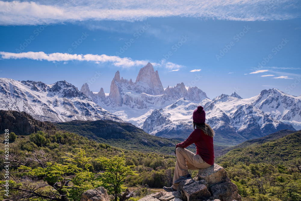 Woman sitting on the point view overlooking Mount Fitz Roy