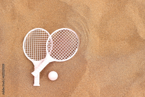 Beach tennis set on sand, summer activity sport © Olga