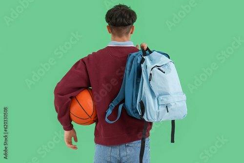 Male student with ball and ...