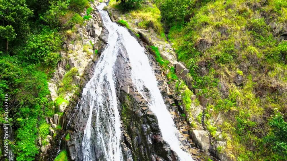 Stunning Aerial Views Capture the Serenity and Elegance of a Long Waterfall on the Hill Stunning Aerial Views Capture the Serenity and Elegance of a Long Waterfall on the Hill