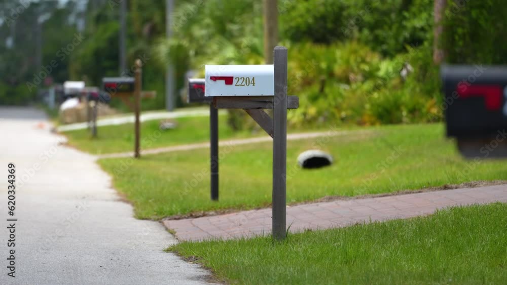 Typical american outdoors mail box on suburban street side Typical american outdoors mail box on suburban street side