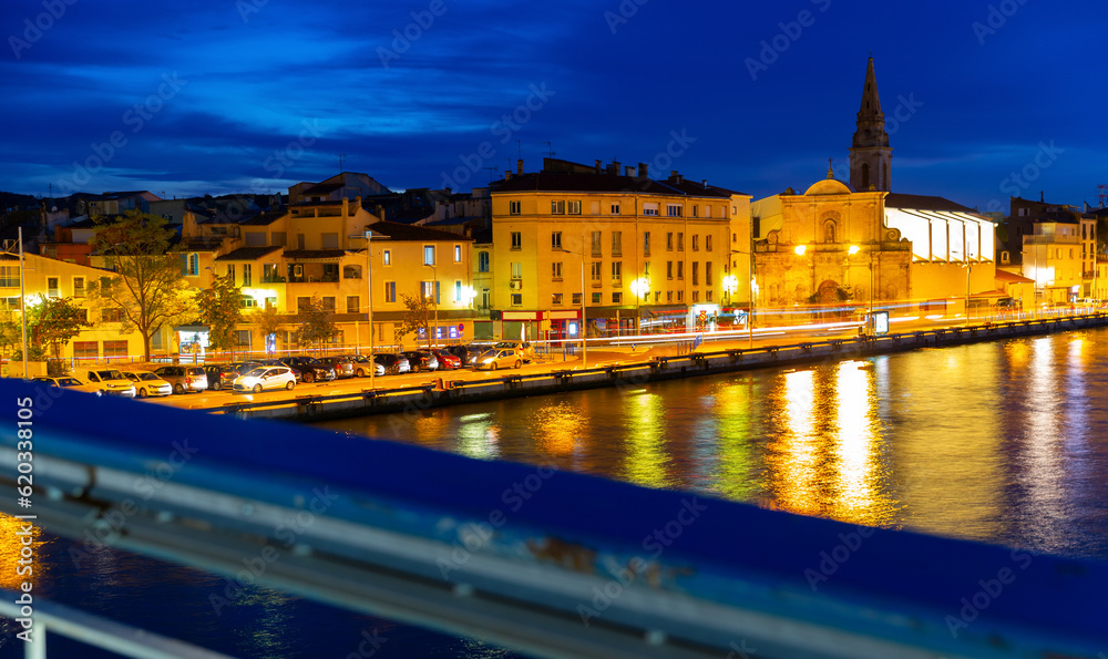 Picturesque evening view of coastal town of Martigues divided by canals with colorful residential buildings along waterfronts in summer, France