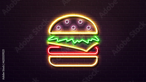 Neon 3d burger with cheese cutlet and salad in a bun in yellow green and red on the background of a brick wall. Poster for fast food.