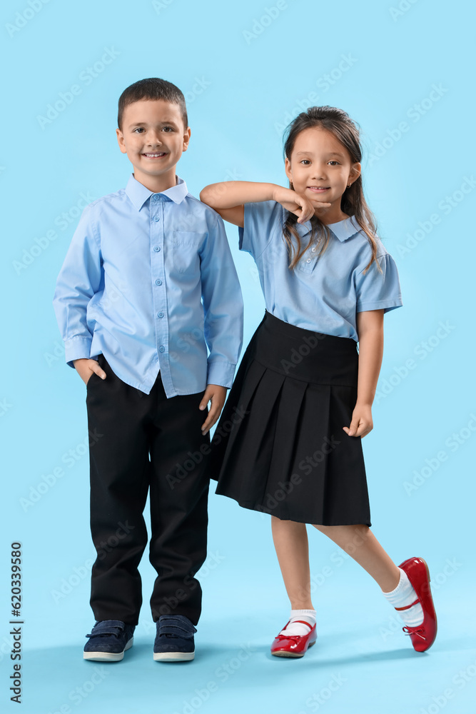 Little schoolchildren on light blue background Little schoolchildren on light blue background