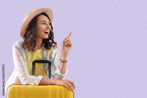 Excited young woman in hat ...
