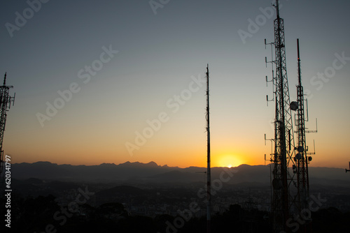radio and television telecommunication antenna towers in the late afternoon sunset photo