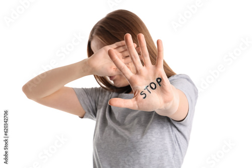 Young woman with word STOP ...