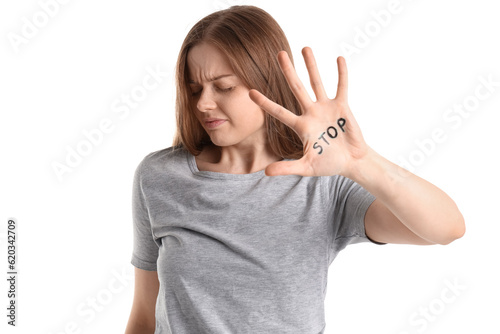 Young woman with word STOP ...