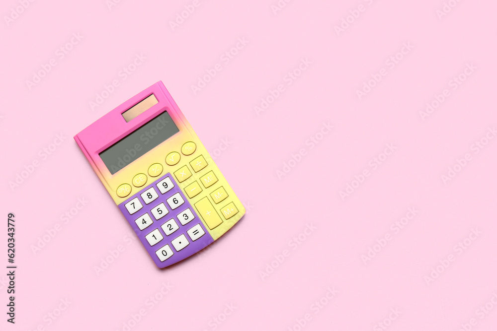 Modern calculator on pink background
